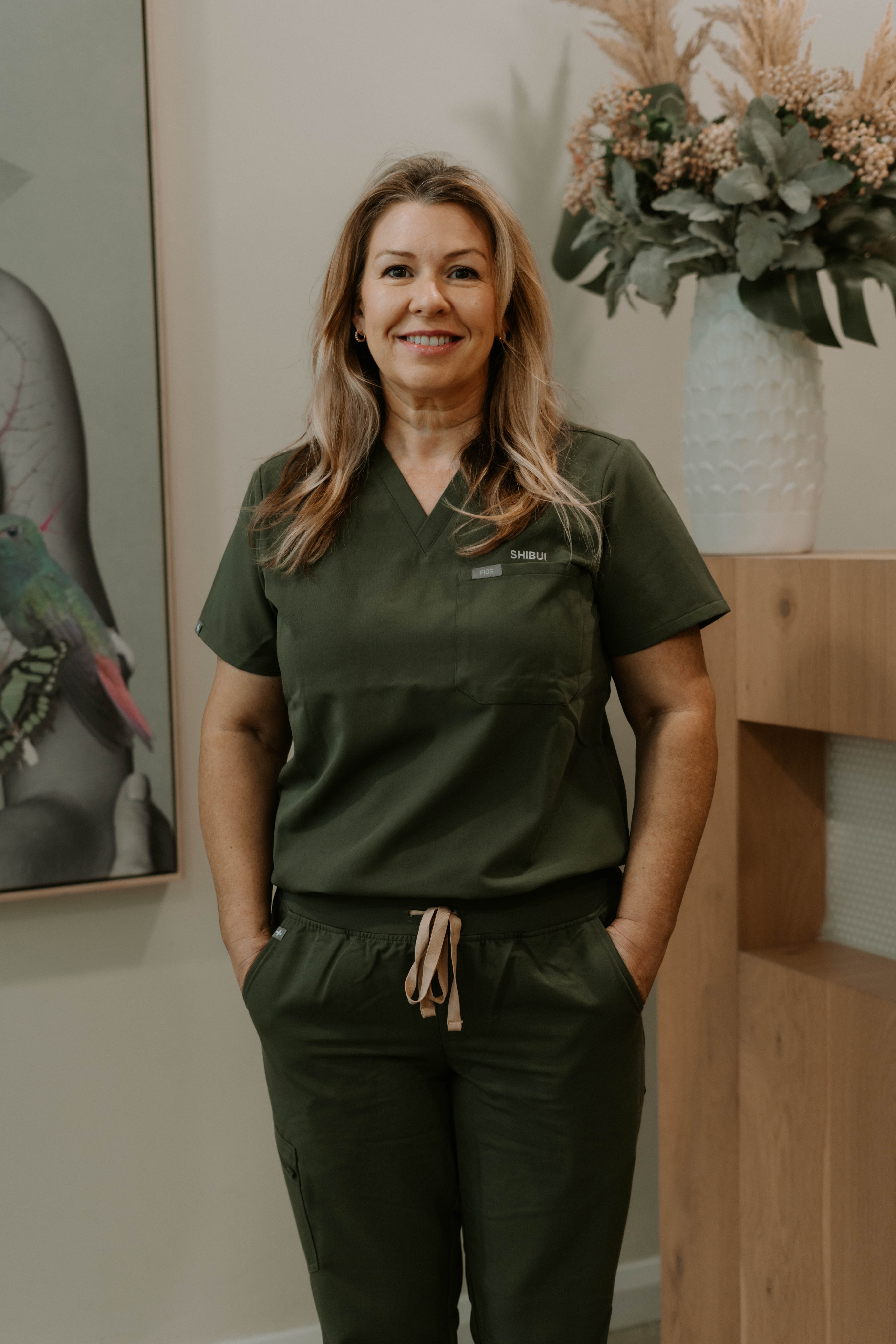 Polaroid photo of a couple posing together on a bed with the date 06/10/19 written on the polaroid.
