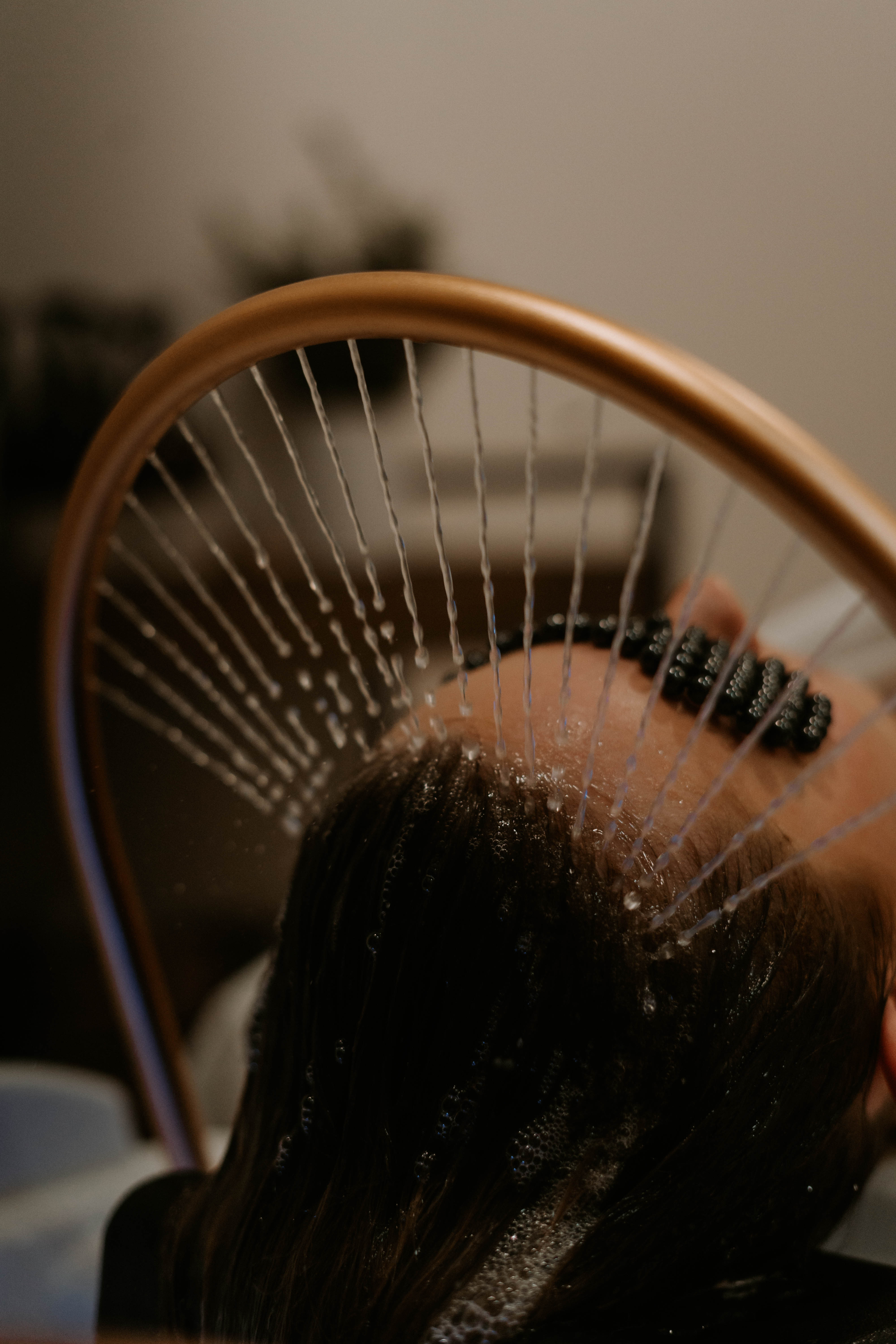 A pear set on a yellow plate upon a soft white canvas texture.